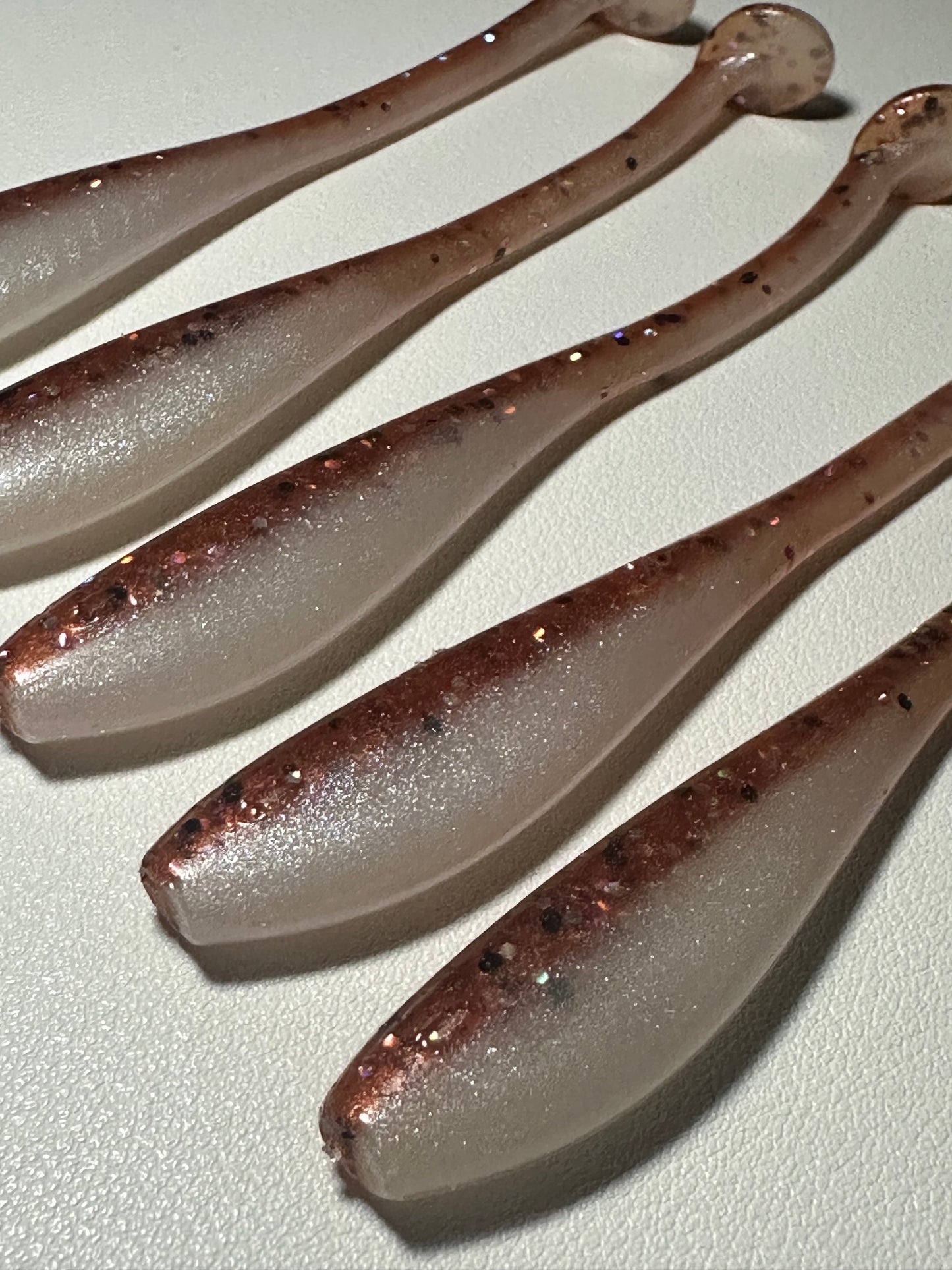 New Penny – 4.5” Dirty Shad Paddle Tail Soft Plastic (8-Pack)