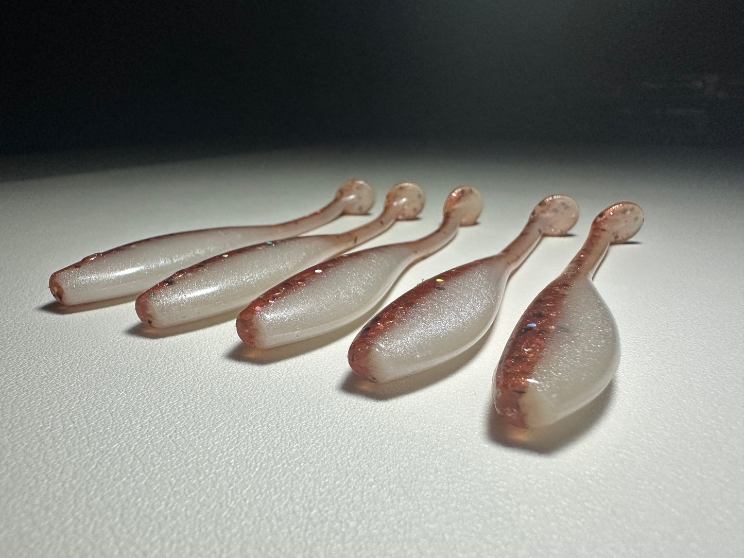 New Penny – 4.5” Dirty Shad Paddle Tail Soft Plastic (8-Pack)