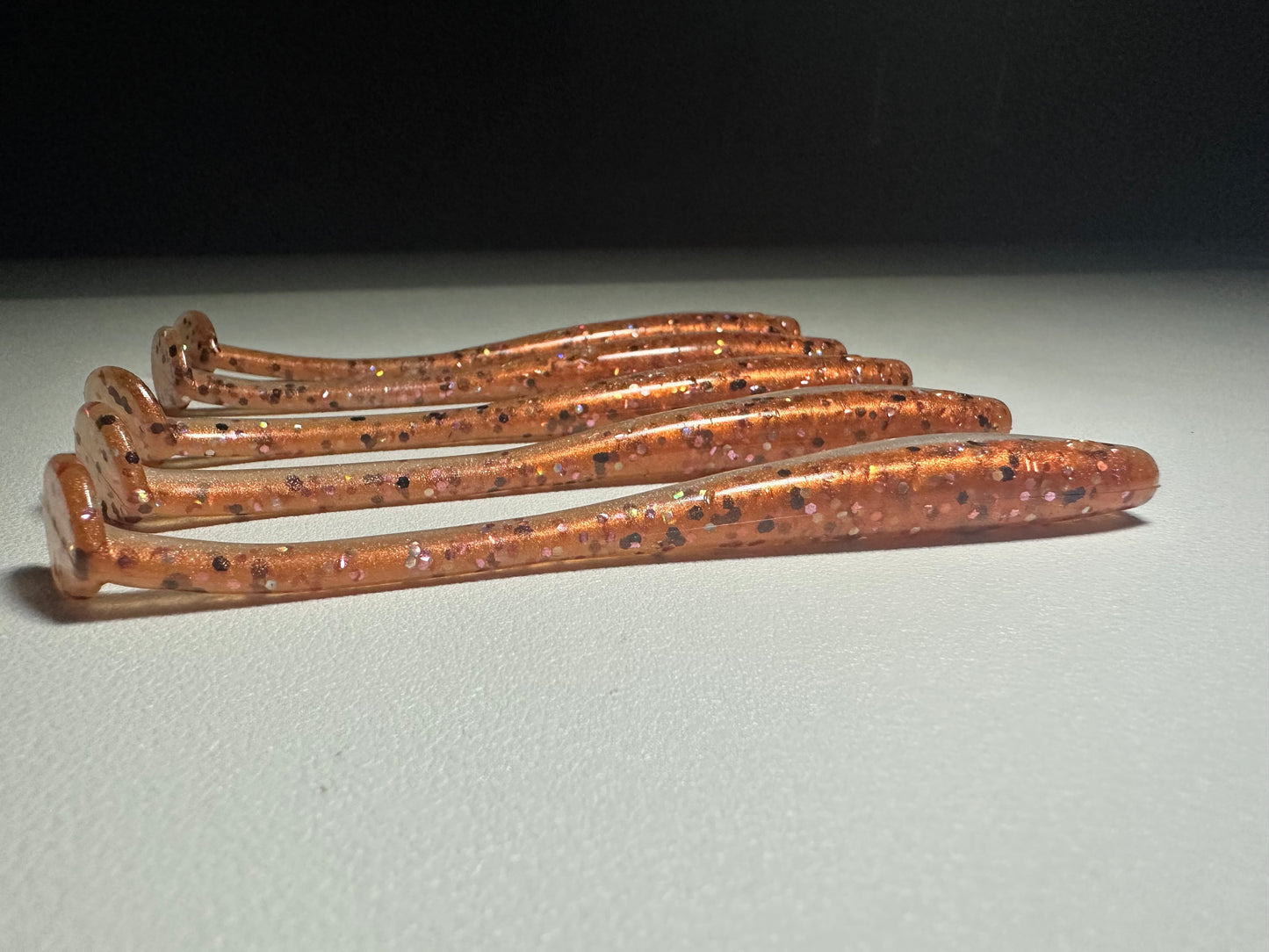 New Penny – 4.5” Dirty Shad Paddle Tail Soft Plastic (8-Pack)