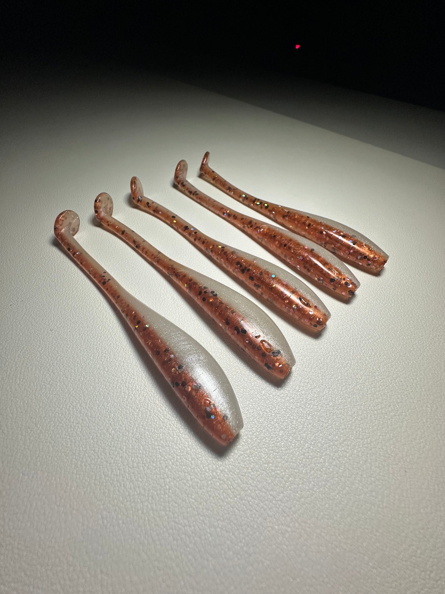 New Penny – 4.5” Dirty Shad Paddle Tail Soft Plastic (8-Pack)