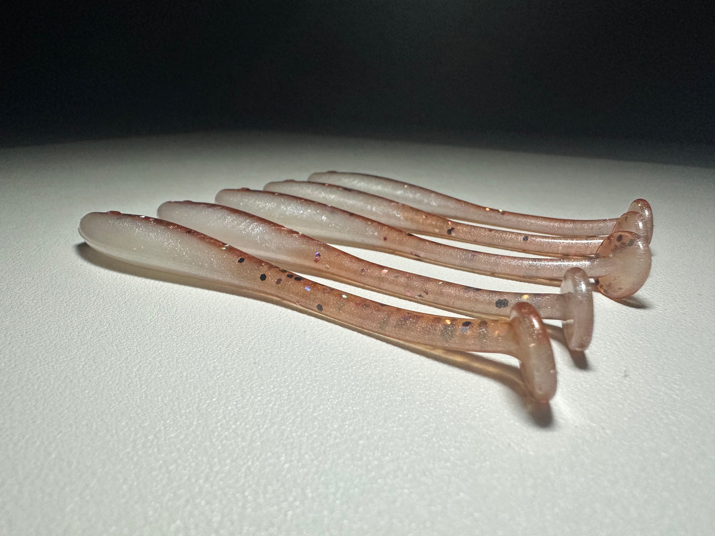 New Penny – 4.5” Dirty Shad Paddle Tail Soft Plastic (8-Pack)