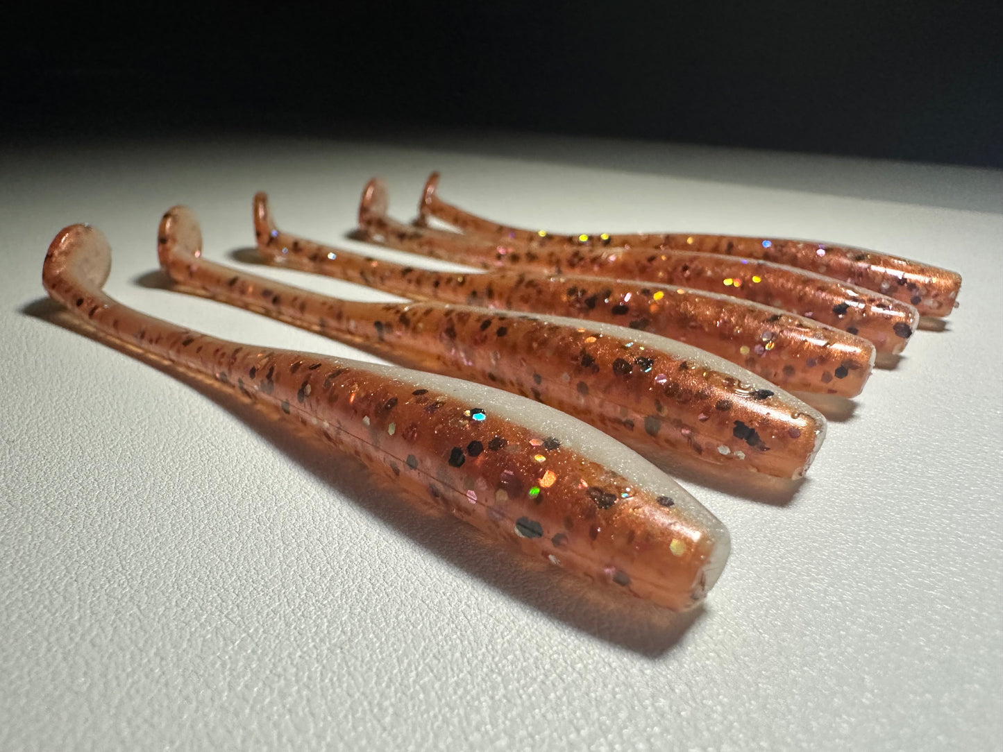 New Penny – 4.5” Dirty Shad Paddle Tail Soft Plastic (8-Pack)